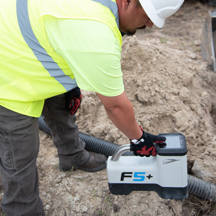 Construction worker performing underground services